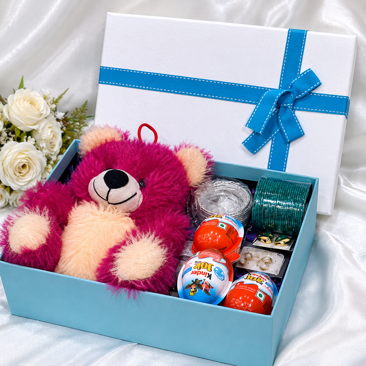 Luxury teddy gift hamper arranged in blue gift box with chocolates, accessories and soft toy