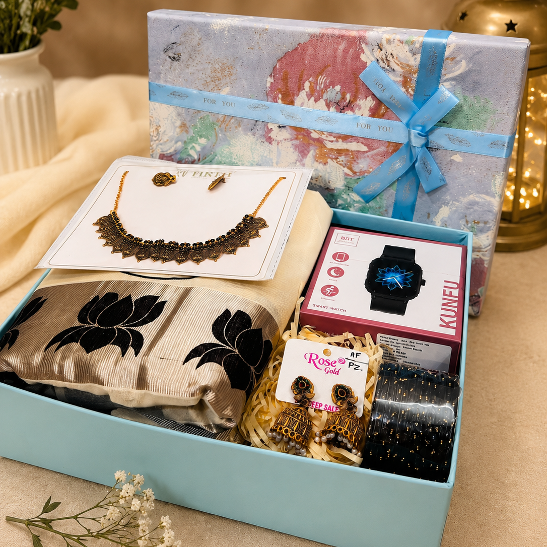 Women’s gift hamper with saree, necklace, earrings, bangles and smart watch in a premium gift box.