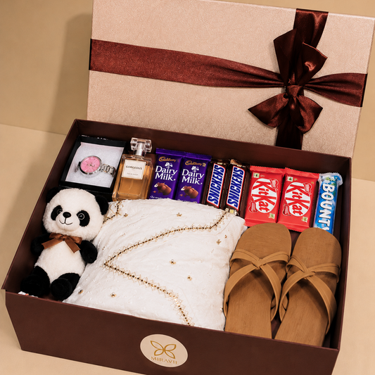 Luxury women's gift hamper with white embroidered dress, wrist watch, chocolates, greeting card and premium Miravie gift box