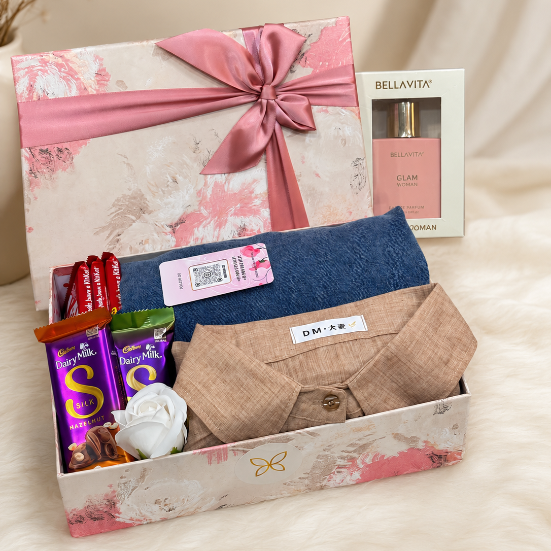 women's gift hamper with premium dress, Bella Vita perfume, Dairy Milk Silk chocolates, KitKat chocolates, decorative flowers, and elegant luxury gift box by Miravie.