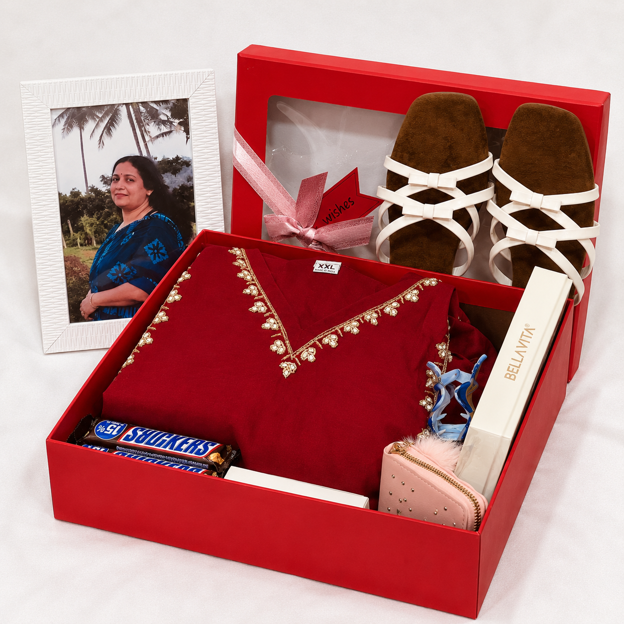 Premium bridal gift hamper with red ethnic dress, white sandals and accessories in luxury gift box
