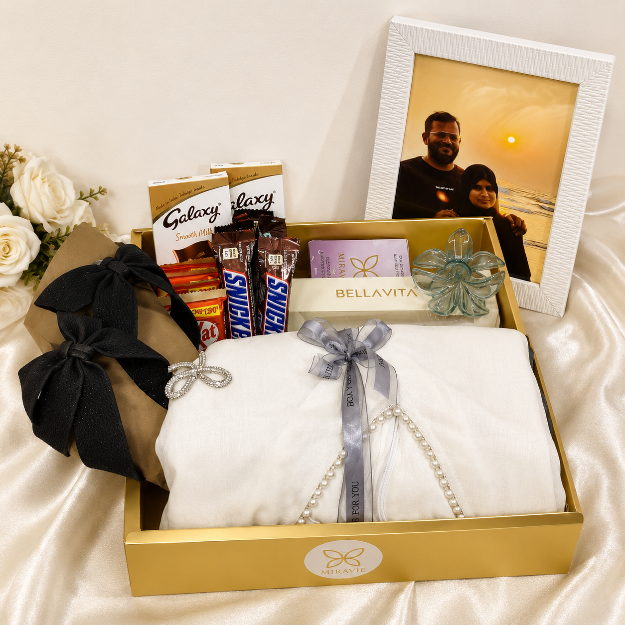 Premium women's gift hamper with party wear dress, Bellavita perfume, chocolates, photo frame and chappal in luxury gift box