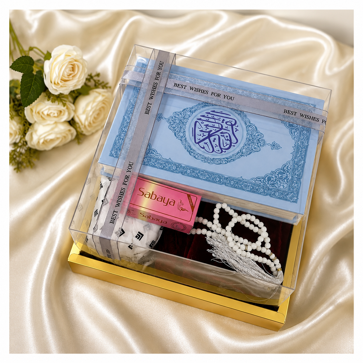 Premium Islamic gift hamper with Quran, prayer dress, tasbih, atthar, prayer mat and chocolates in luxury gift box