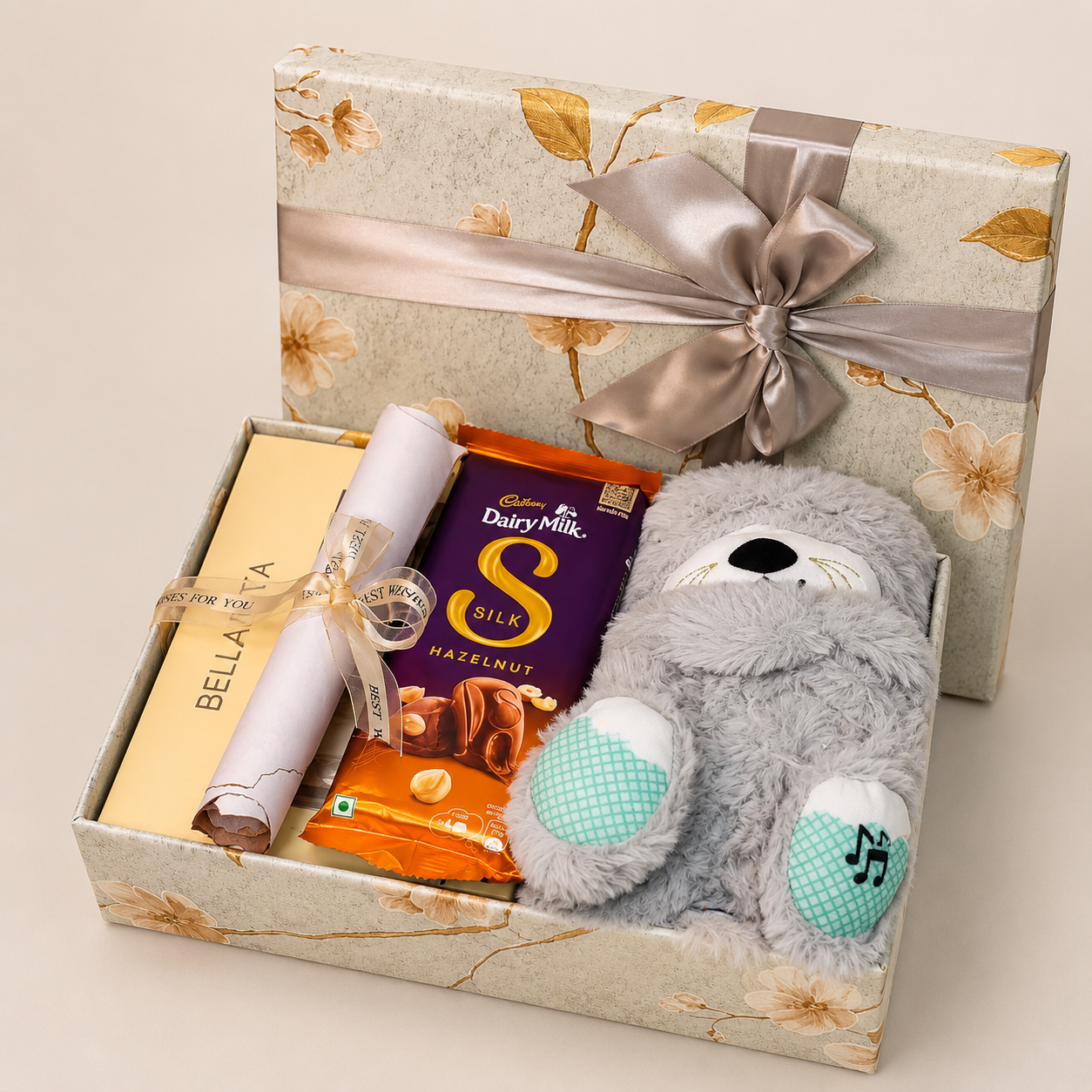Premium breakup hamper featuring a breathing teddy, Bella Vita mini perfume combo, Dairy Milk Silk chocolates, heartfelt breakup letter, and luxury floral gift box.