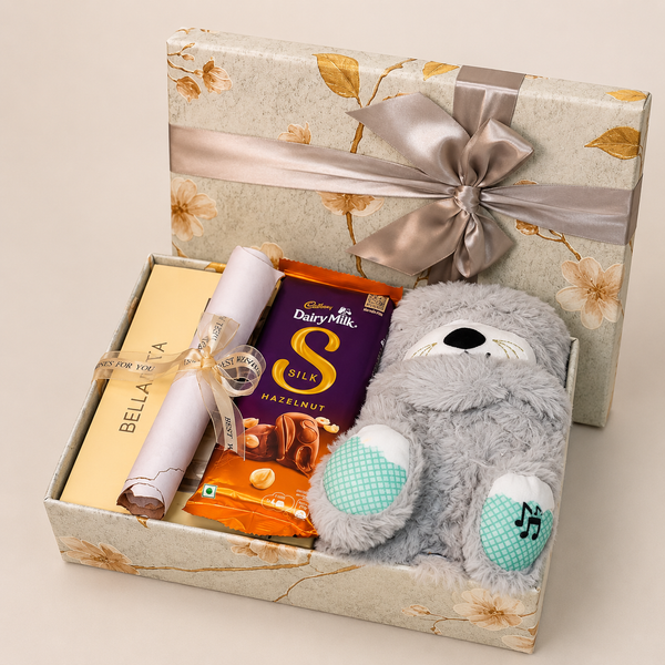 Premium breakup hamper featuring a breathing teddy, Bella Vita mini perfume combo, Dairy Milk Silk chocolates, heartfelt breakup letter, and luxury floral gift box.