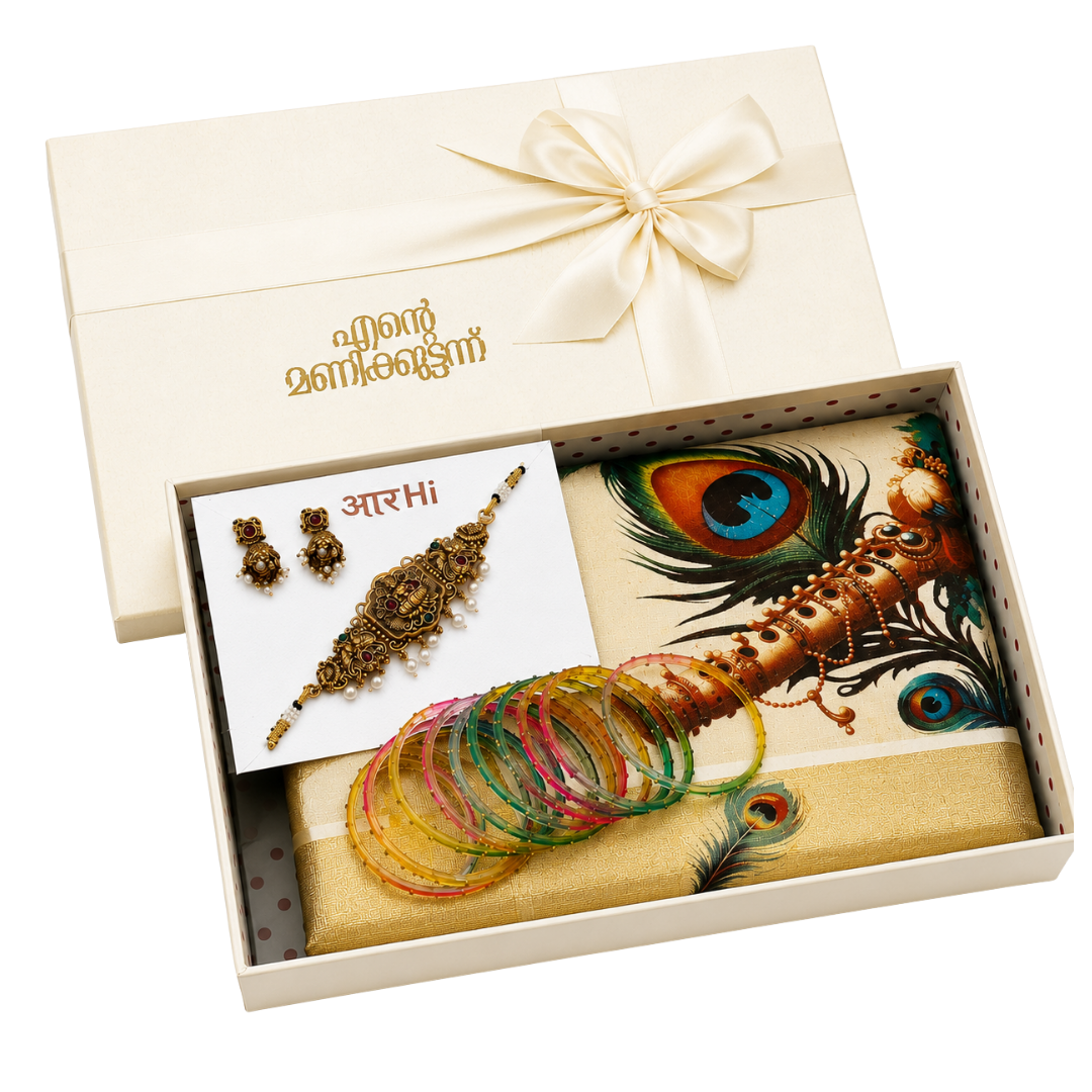 Premium Onam gift hamper featuring a Kerala Kasavu saree with peacock design, traditional temple jewellery set, colourful glass bangles, acrylic decorative accessory, and a luxury satin ribbon gift box for festive gifting.