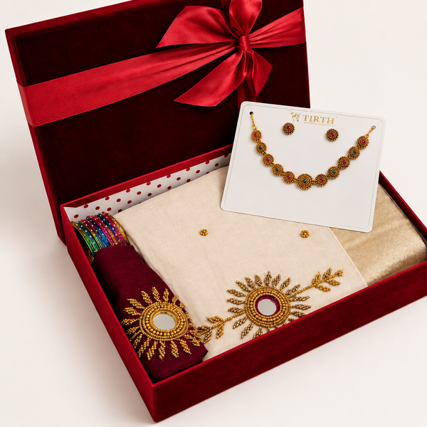 Premium Onam gift hamper with traditional saree, elegant necklace, colourful bangles, and luxury red gift box packaging for women.