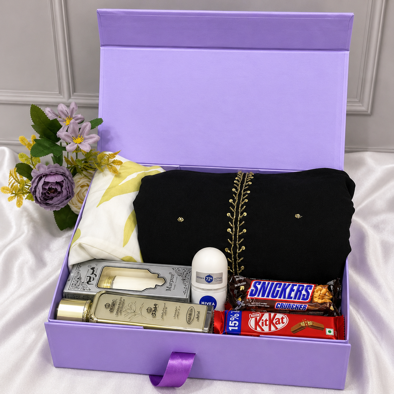 Luxury women's gift hamper with a party wear dress, fashion top, lotions, chocolates, and premium gift box.