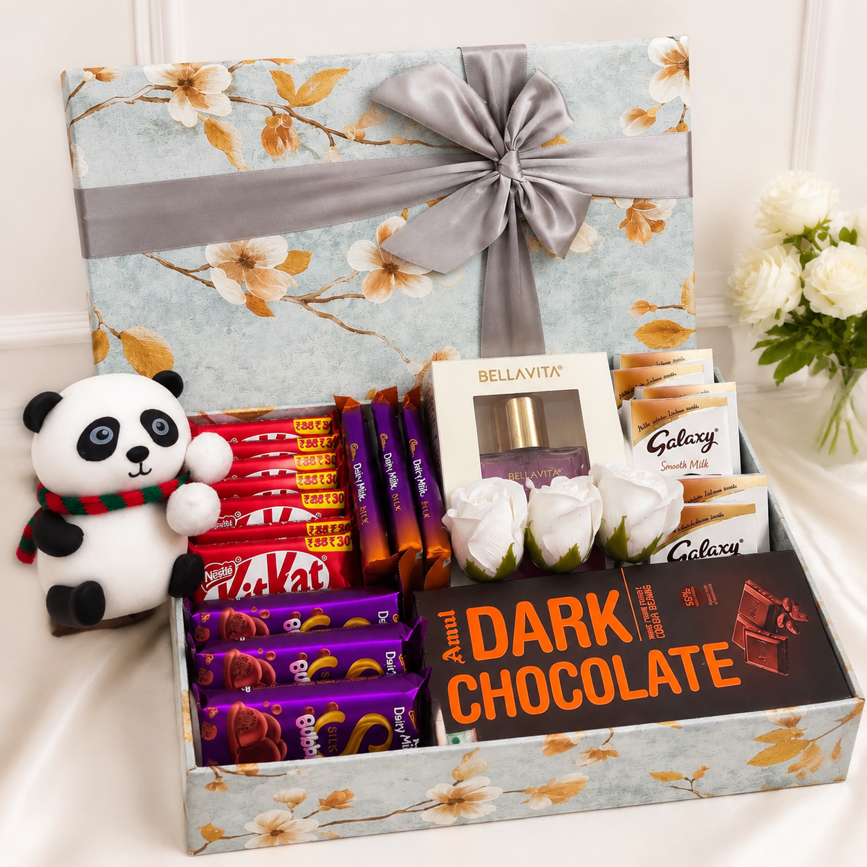 Chocolate Lover's Gift Hamper with panda teddy, perfume, KitKat, Dairy Milk, Galaxy and Amul chocolates decorated with flowers in a premium gift box.
