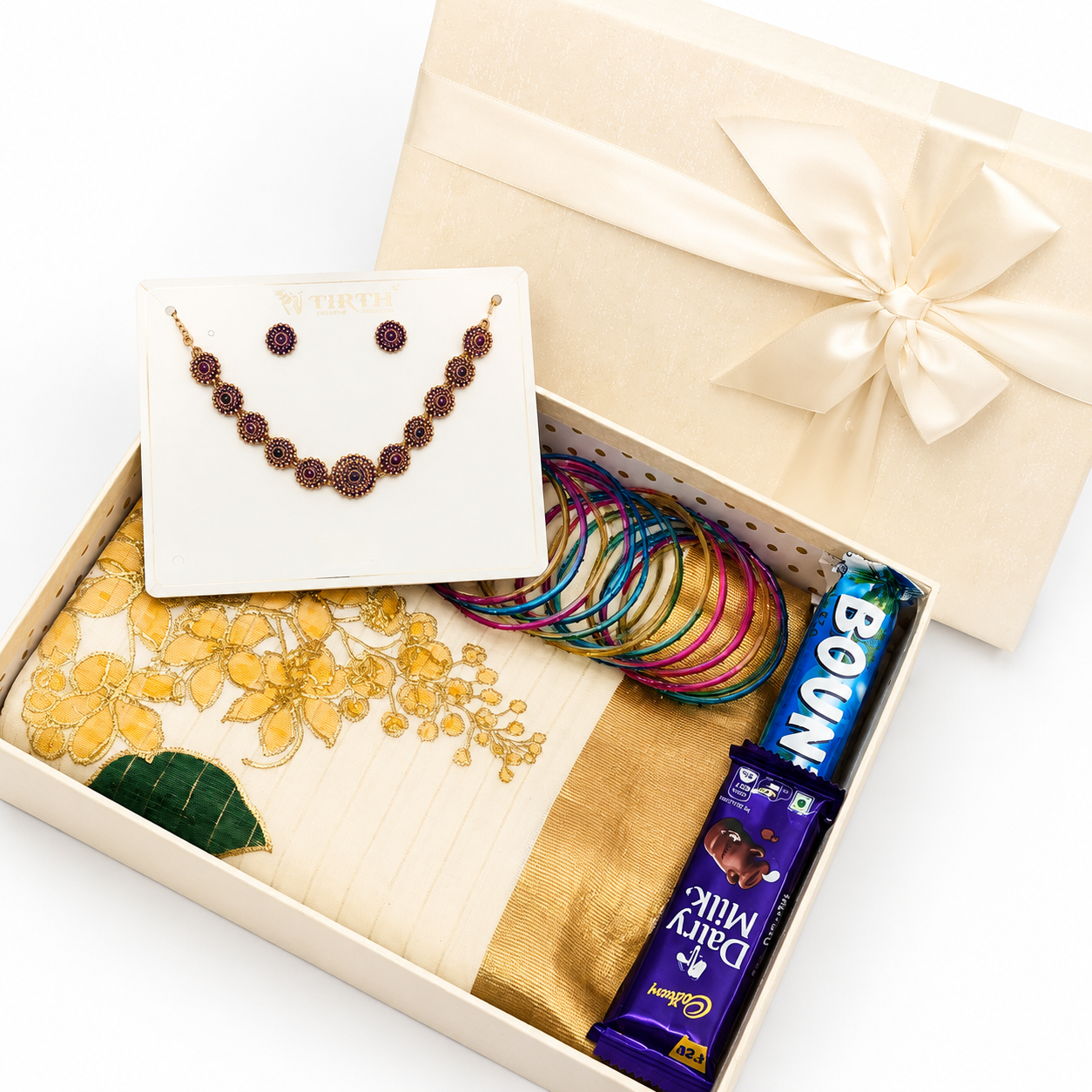 Premium Onam gift hamper with traditional saree, necklace, glass bangles, Dairy Milk chocolates, Bounty chocolates, and luxury gift box packaging.
