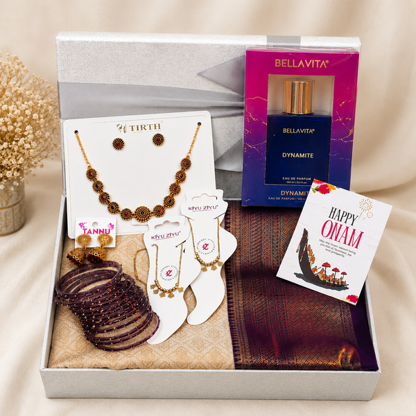 Premium Onam gift hamper with Kerala traditional saree, temple jewellery set, decorative glass bangles, traditional anklets, Bella Vita perfume, Happy Onam greeting card and luxury reusable gift box.